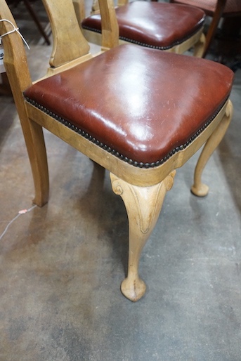 A set of four Queen Anne style pale walnut dining chairs with Merryweather plaques